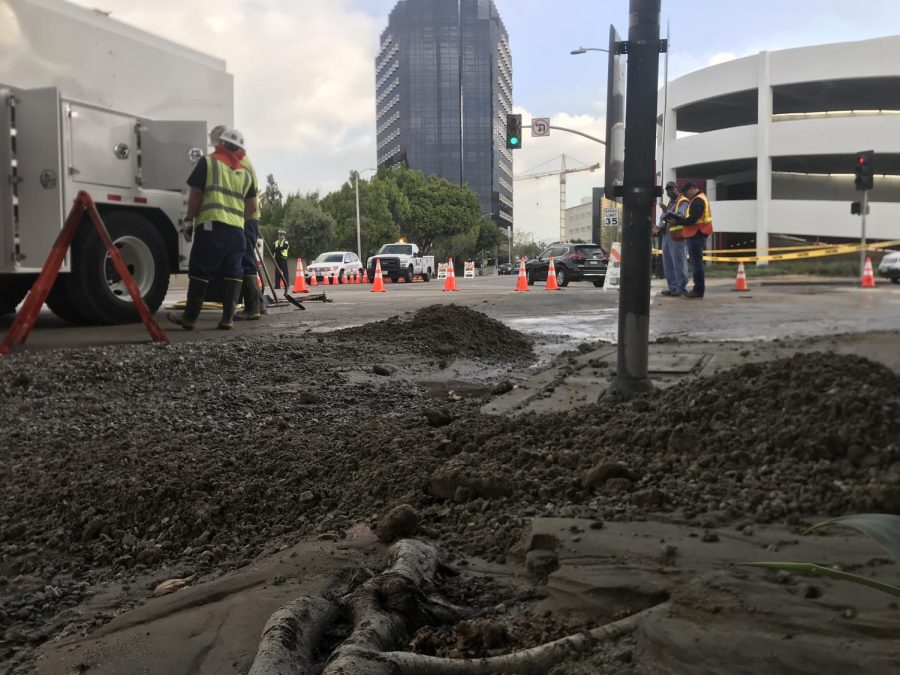 WORKERS: Crews from power and gas companies worked at Fairfax and 8th Street this morning to find safe access to the broken water main.