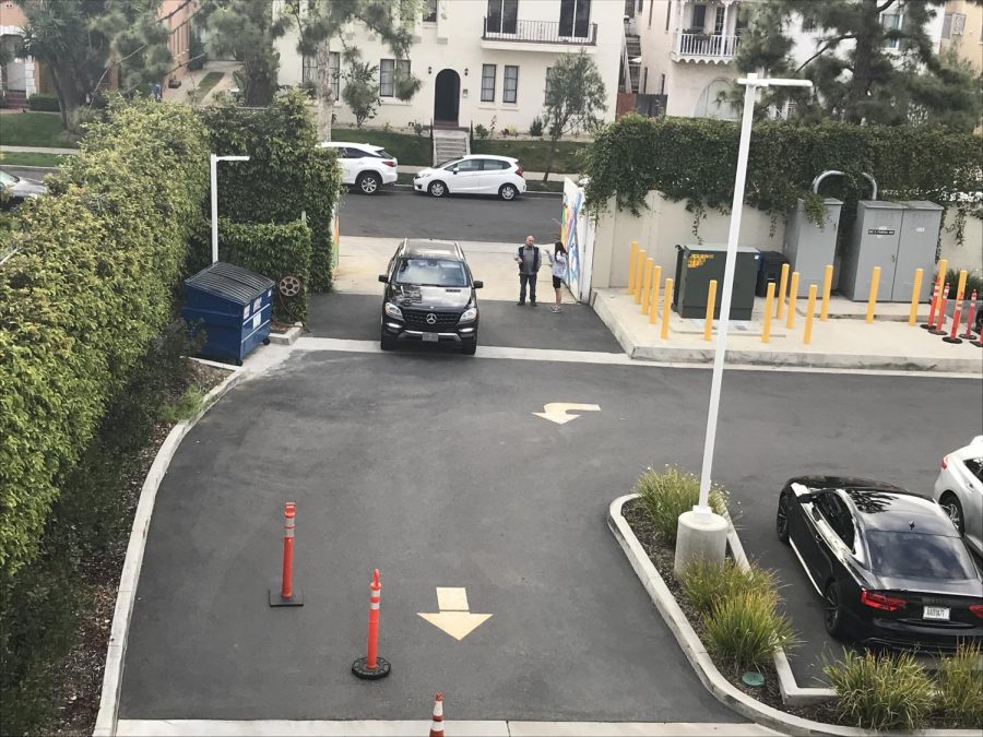 CARPOOL: School officials opened the service driveway on Orange Grove for carpool this morning when flooding caused the closure of Fairfax Avenue, where the school driveway is.
