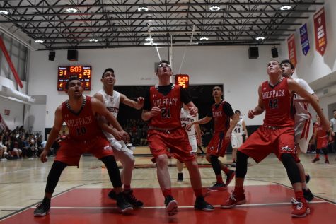 RIVALRY:  Firehawk and Wolfpack players fought for position to get a rebound in the Firehawks’ 55-41 victory over the Wolfpack on the opening night of the Glouberman Tournament last fall. Following Shalhevet’s CIF quarterfinal loss 56-48 to Palm Springs in February, allegations surfaced that the Valley Torah coach gave the Palm Springs coach information about Shalhevet prior to the game, though Valley Torah denies any “malicious” encounter.
 