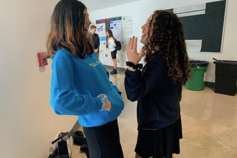 TRENDY: Like many other students, freshmen Eva Brous-Light and Danielle Finn wear scrunchies, a popular hair accessory from the ‘80s, to school -- and not always in their hair.