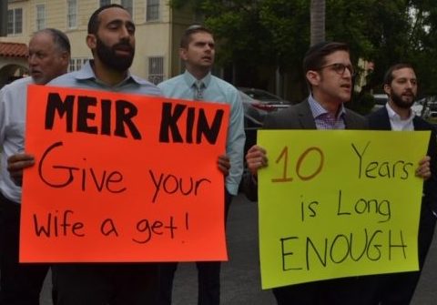 PROTEST: From left, Shalhevet faculty Rabbi Yitzchak Etshalom, Dr. Jonathan Ravanshenas, Mr. Chris St. Germaine, and Rabbi David Block stood outside a home on Poinsettia Place in Hancock Park to support Lonna Ralbag’s right to a get, or religious Jewish divorce,  Aug. 23. Agunah activist Rabbi Jeremy Stern joined them, at right.