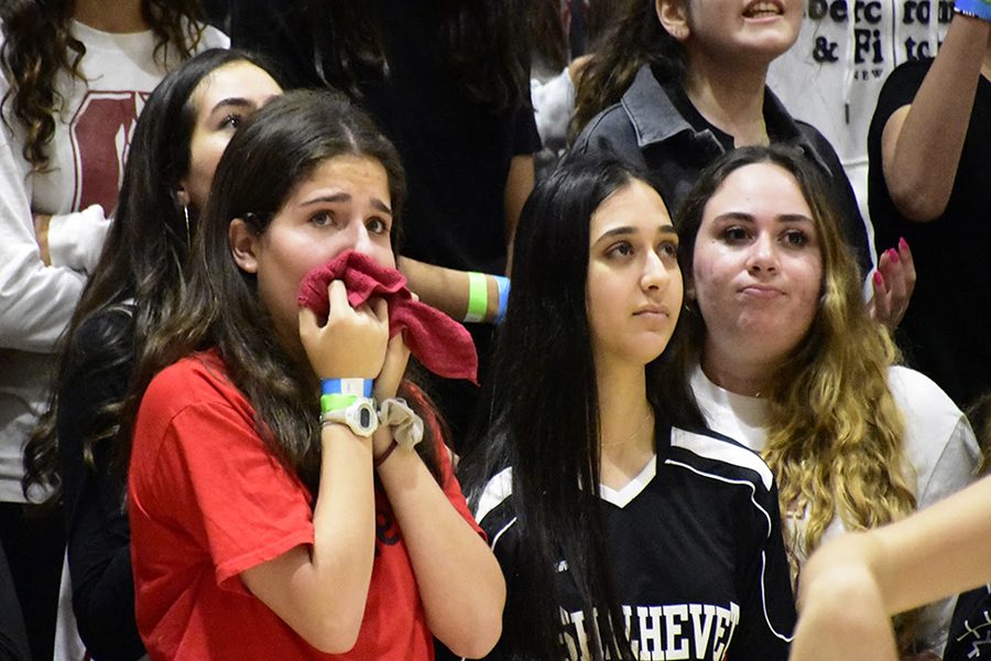 EMOTIONAL:  From left, seniors Nicole Klausner, Eliana Mizrahi and Shayna Becker were among Firehawk fans worrying in the final moments of Shalhevet girls’ 65-61 semi-final loss to the SAR Sting in the Glouberman Tournament Nov. 9. The Firehawks led by as many as 16 points before halftime but were unable to eke out a win in a nail-biting repeat of last year’s tournament. The Maimonides MCATS won the girls tournament, and the Frisch Cougars beat the Firehawk boys to win the boys.