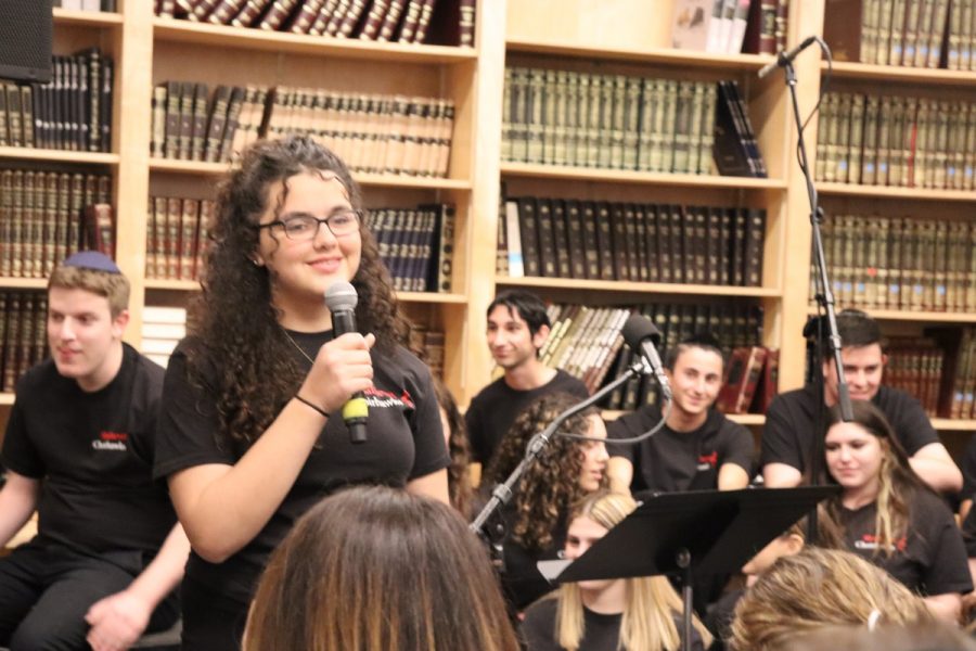 Sophomore Talya Kukurudz sang “Make you feel my love,” by Bob Dylan, one of two solo performances in the Choirhawks “Back from the Bay” performance on Dec. 18. 