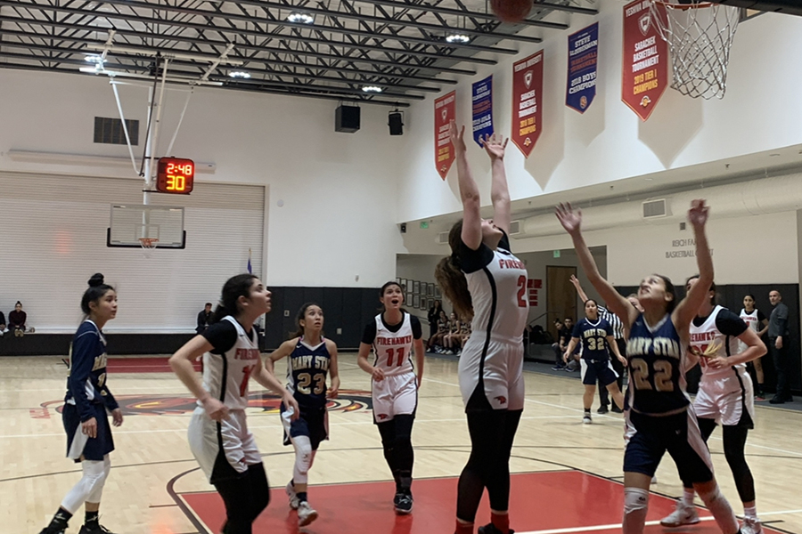 SOAR: Senior Avital Jacobson goes up for a rebound in the Firehawks’ 71-46 victory over Mary Star of the Sea Feb. 17. The team has advanced to the quarterfinals of the CIF Division 4A playoffs and will play an away game at Campbell Hall in Studio City tonight at 7 p.m.