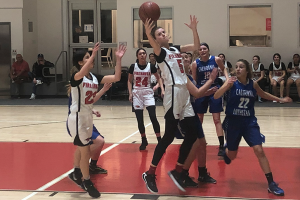 BOARD: Senior center Elianna Kupferman secures an offensive rebound in the Firehawks’ 64-28 over the Cal Lutheran C-Hawks Feb. 13. Shalhevet has advanced to the second round of the CIF Division 4A playoffs, and will face off against Mary Star of the Sea on Monday night at the Shalhevet gym.