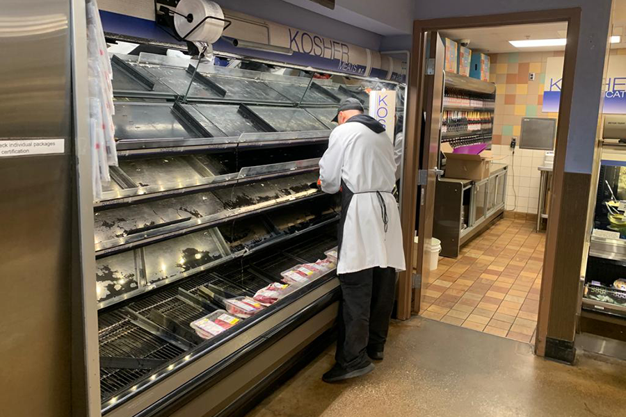 ADJUST: Kosher meat cases were empty at Ralphs on LaBrea March 15 as consumers rushed to buy products before countywide stay-at-home orders were issued, though workers had assured shoppers they would be restocked the next day.