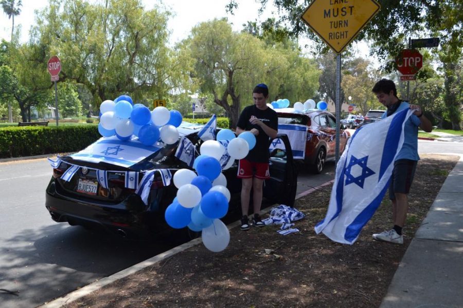 DECORATIONS: Seniors Ben-Tsion Oliel and Noah Hertzberg plastered their cars with Israeli flags and blue and white balloons before the parade. The goal was to celebrate while observing social distancing.