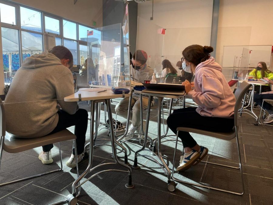 LEARNING: Students in Rabbi Stein’s ninth grade AGS class sit behind plexi-glass dividers in the Beit Midrash Nov. 17.  There are around 48 students across ninth, 11th and 12th grade who attend on-campus tracks, compared to 120 students who would have been on campus for 3- 4 hours per day if school had opened for Judaic Studies.