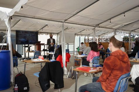 BACK: Rabbi Block taught his senior Advanced Jewish Philosophy class in person for the first time Dec. 1, in the ‘Sarah’ tent outside the Beit Midrash on the third floor.  Outdoor temperatures that day were in the upper 60s.