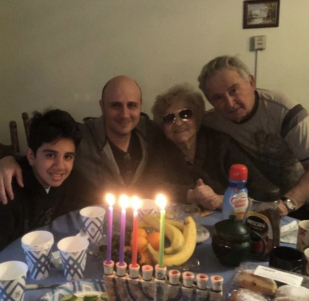 CONNECTION: Jacob sees his great-grandparents, Victor and Lyuba, twice a week, and they all speak Russian together. Above, they celebrated Chanukah together in 2014, along with Jacob’s dad, Eugene, sitting between them.