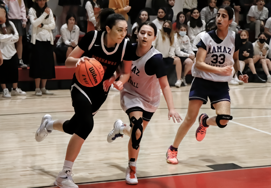 POWER: Firehawk co-captain Talia Tizabi dribbles around a Ramaz defender in the quarterfinals game on Friday. The Firehawks won that game 60-47, and Talia went on to be named tournament MVP. To see more pictures, click on "Gallery" above.