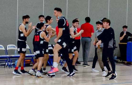 CELEBRATE: The Firehawks bench erupted in enthusiasm as the final buzzer went off in the championship game against the Milken Wildcats in the Milken Classic Basketball Tournament. The Firehawks won 55-46 with Avi Halpert scoring 26 points. 