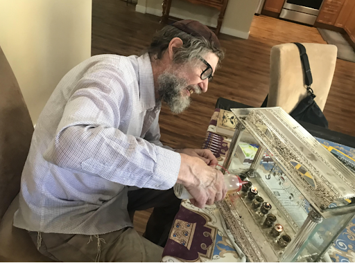SUCCESS: Dr. Walter Poor, Hinda Grosss grandfather, poured olive oil for fuel into the metal cups of his hanukkiah.  It was the sixth night of Hanukkah – also his birthday.