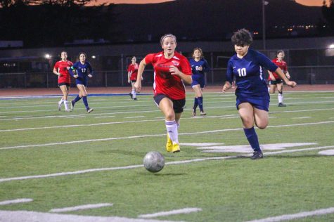 SPRINT: Sophomore Atara Cohen charged for the soccer ball as she tried to defend Garey High School from scoring a goal. The Firehawks fell short of the win, losing 2-1 in an overtime nail biter. 