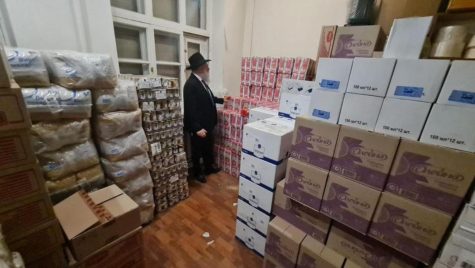 Rabbi of Chabad of Kyiv standing in storeroom