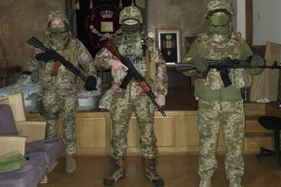 Soldiers standing guard at Chabad of Kyiv on Purim March 17.