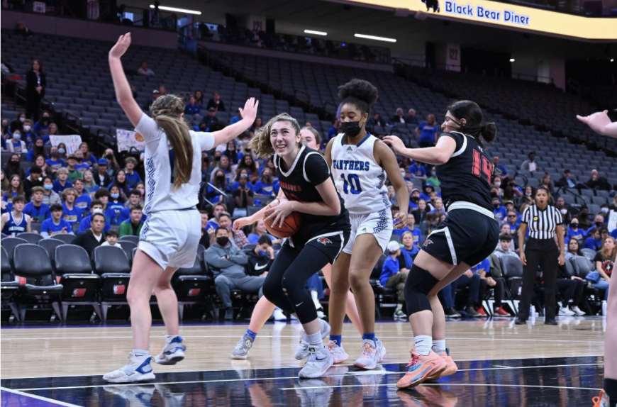 EFFORT: Senior Talia Tizabi, who plays center and is a team captain, drove to the hoop and scored a layup. She led the team with nine points in the first-ever appearance by a Jewish high school team in a CIF girls basketball championship.
