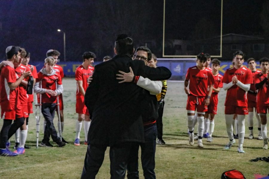 TOGETHER: Rabbi Block  (facing camera) and Rabbi Sufrin hugged before the Shalhevet vs. YULA soccer game March 19 in a display of public unity.
