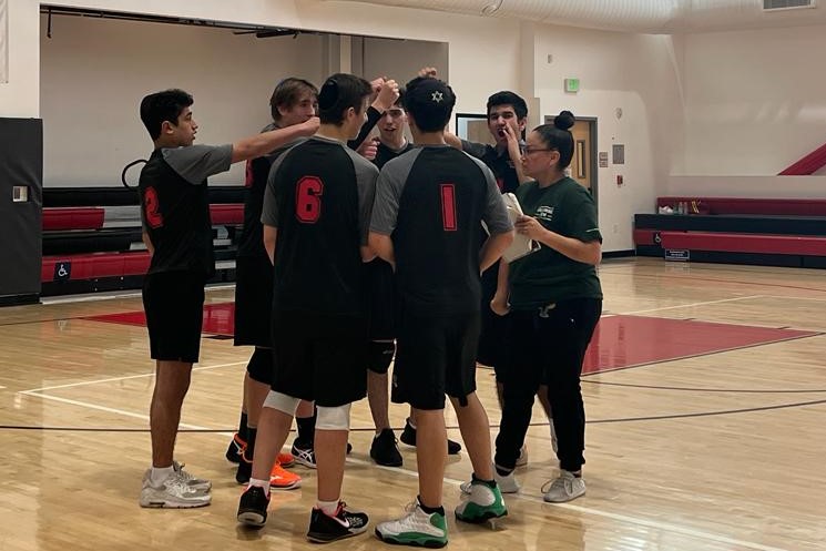 EXCITEMENT%3A+Boys+Volleyball+team+huddles+together+with+Coach+Jelly+Castellanos+after+a+three+to+zero+win+over+the+Animo+Leadership+Aztecs%2C+ensuring+a+spot+in+the+playoffs%2C+April+13.