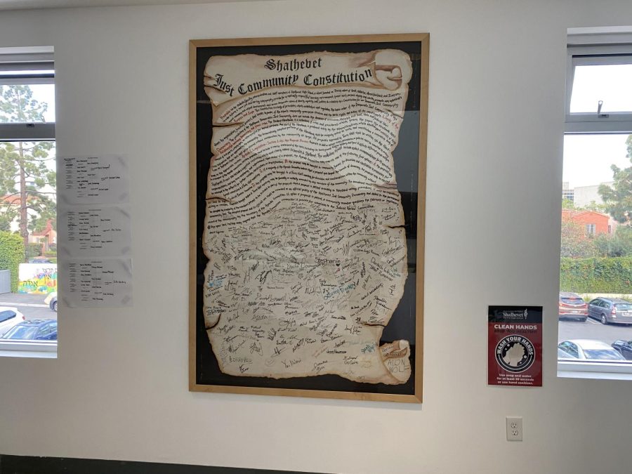 OLD: The school’s original Just Community Constitution, currently displayed in the second-floor stairway lobby, was signed by students in 2003.