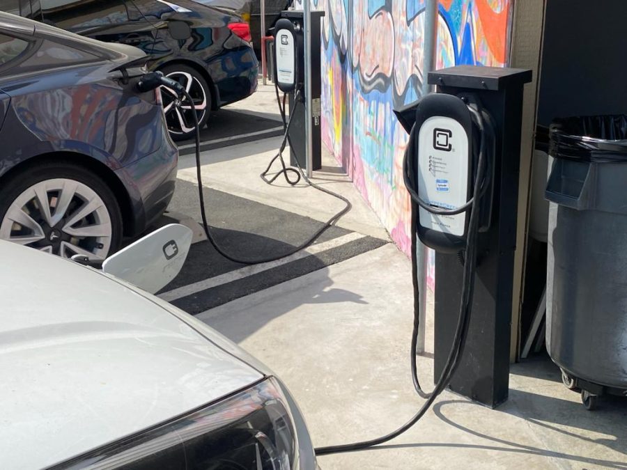 CHARGERS: Shalhevet has three EV charging stations, above, in the faculty parking lot. A portion of the Inflation Reduction Act allocates funds to build more to motivate people to purchase electric cars.  
