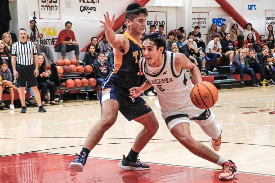 DRIVE: No. 6 Nathan Sellam heads to the basket in Wednesday’s opening victory over TABC.. Nathan was the game’s second-highest scorer with 18 points. 