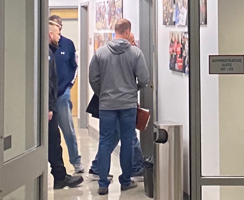 MEETING: Shalhevet security guard Sean C., at left in black, and Buena Park parents met in Rabbi Blocks office to resolve a misunderstanding about a girl who was pushed while Mr. C. was running to check on a report of an issue on Fairfax after the game Feb. 18.