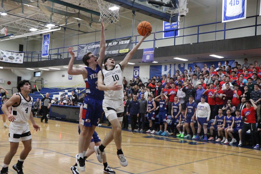 WIN: Senior Elijah Stern shoots a layup against MTA in the YU gym earlier today. Shalhevet won the game 48-36.