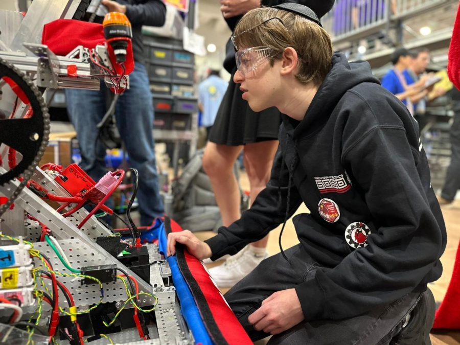 FOCUS: Robotics team member Jaden Silver studied the wiring for Rakhamaiella Hatzlakha on Day 3 of the FIRST Robotics Competition, held this year at DaVinci High School in El Segundo.