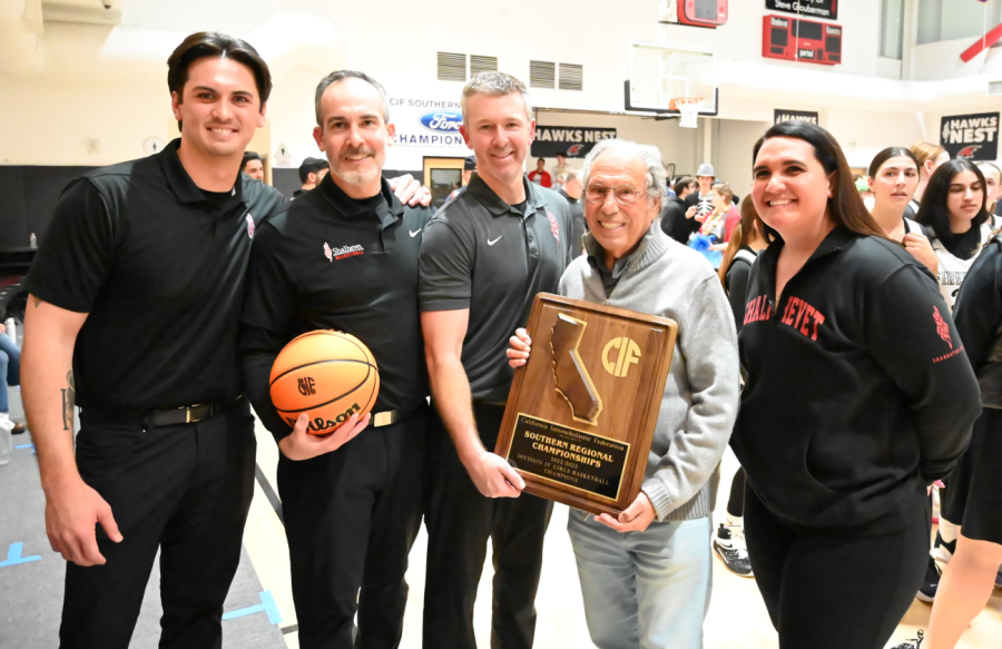 WIN: From left, Coaches Adam Plax, Andrew Schultz, Ryan Coleman and Jena Laolagi with Shalhevet founder Dr. Jerry Friedman, center, holding the championship trophy plaque after the Firehawks won the CIF Southern Regional Championship at a home game in the gym March 7.  Coaches Plax, Schultz and Laolagi all will start new head coaching jobs in area high schools next year.