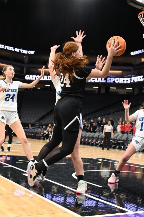 PASS: Junior Yalee Schwartz (24) passes the ball to the other side of the court after driving into the hoop during the CIF Division IV state basketball championship at the Golden 1 Center, March 16.