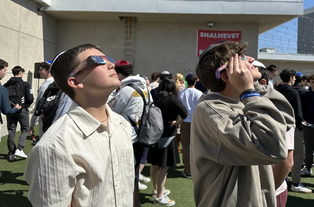 GLASSES: Made of paper (not glass), the latest protective eyewear was shared with all students and staff who wanted to view the eclipse, enabling them to turn their gaze straight up to the sky.