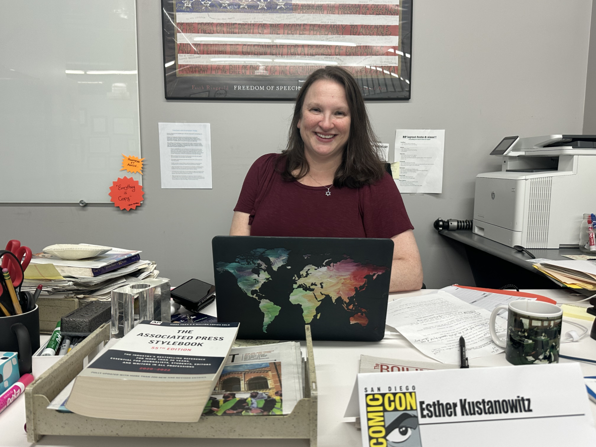  Ms. Esther Kustanowitz sits at her desk in the Boiling Point office in the basement. She first started working in journalism as a high schooler, writing for her school newspaper and at a local Jewish publication.