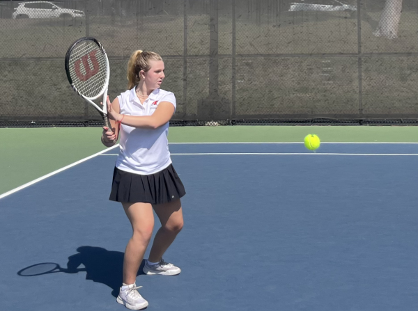 BACKHAND: Co-Captain Dana Treitel setting up to hit the ball in their game against Pacifica Christian on Sept. 27. This was the first win in program history for girls tennis, and the team would go on to win two more games.